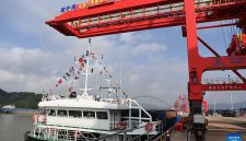 A cargo vessel prepares to depart for Yangpu Port in south China's Hainan Province along the Pinglu Canal at an operation area in Nanning Port, south China's Guangxi Zhuang Autonomous Region, Sept. 16, 2026. China opened a major new canal on Wednesday, giving its landlocked southwest a shortcut to the coast and overseas markets, particularly those in the Association of Southeast Asian Nations (ASEAN), the country's largest trading partner. Built at a cost of 72.7 billion yuan (about 10.75 billion U.S. dollars), the 134.2-kilometer Pinglu Canal runs from Nanning, capital of south China's Guangxi Zhuang Autonomous Region, to the Beibu Gulf, the closest maritime outlet for much of southwest China. (Xinhua/Cao Yiming)