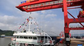 A cargo vessel prepares to depart for Yangpu Port in south China's Hainan Province along the Pinglu Canal at an operation area in Nanning Port, south China's Guangxi Zhuang Autonomous Region, Sept. 16, 2026. China opened a major new canal on Wednesday, giving its landlocked southwest a shortcut to the coast and overseas markets, particularly those in the Association of Southeast Asian Nations (ASEAN), the country's largest trading partner. Built at a cost of 72.7 billion yuan (about 10.75 billion U.S. dollars), the 134.2-kilometer Pinglu Canal runs from Nanning, capital of south China's Guangxi Zhuang Autonomous Region, to the Beibu Gulf, the closest maritime outlet for much of southwest China. (Xinhua/Cao Yiming)